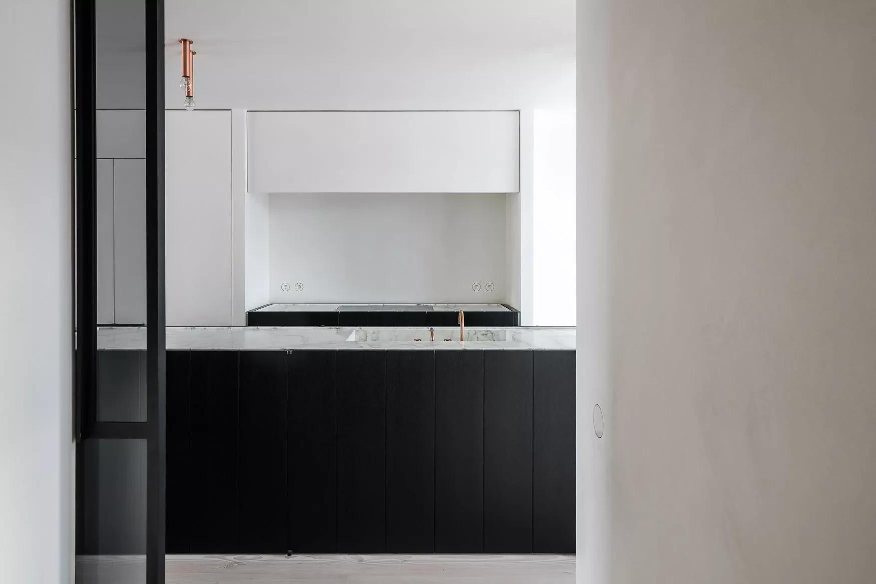 Doorway with view of kitchen island