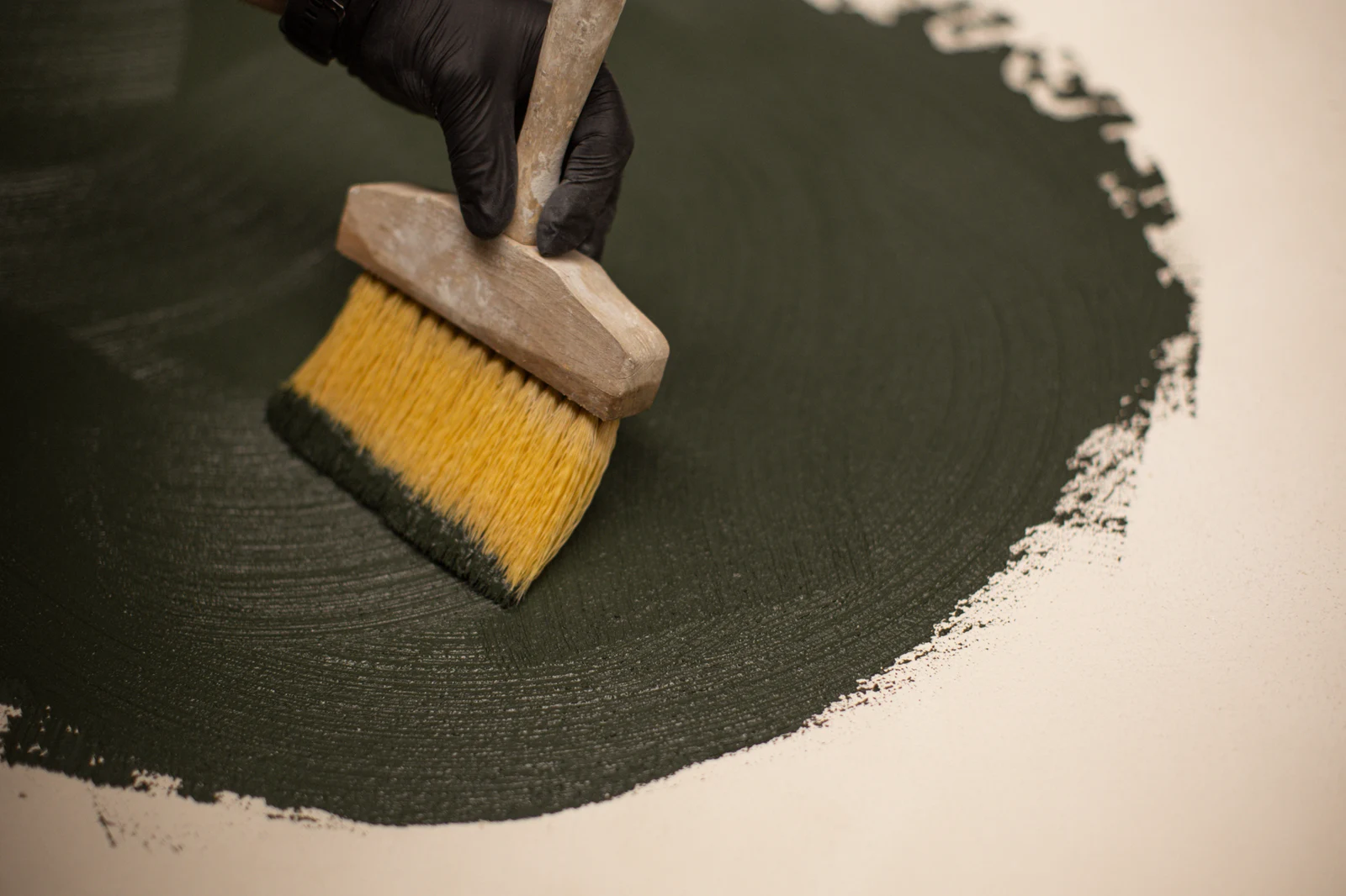 Hand-applying an Odilon mineral finish with a brush