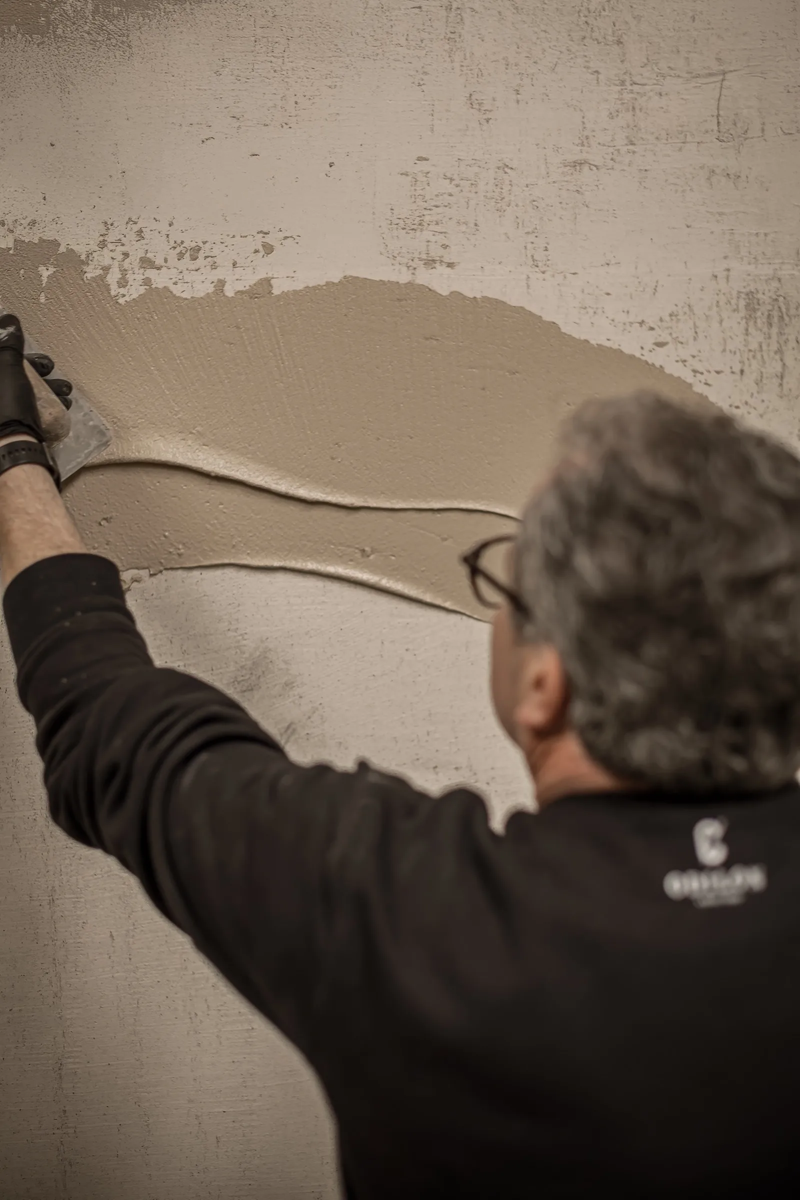 Installer applying an Odilon floor finish with a trowel