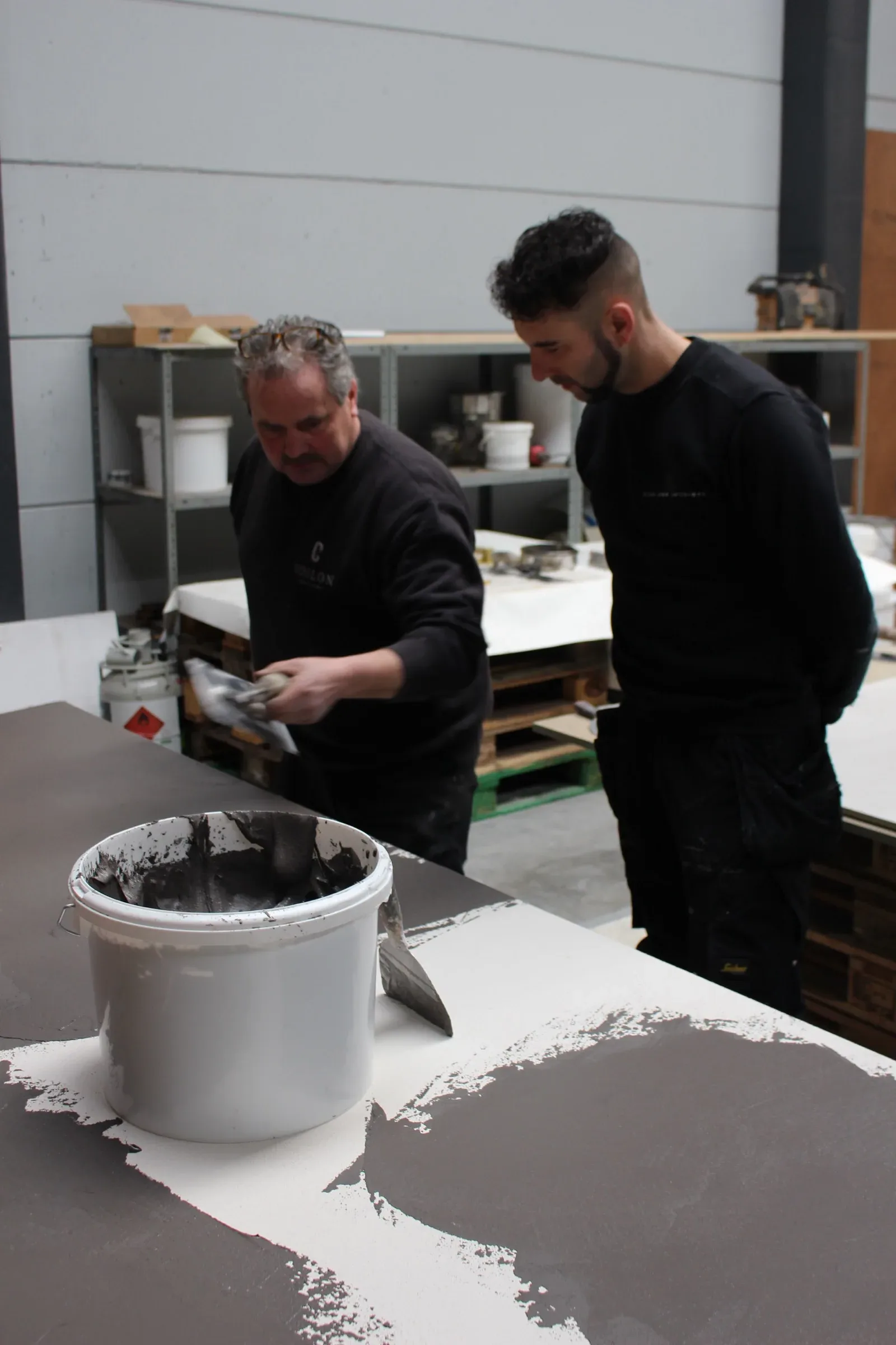 Installers practising a plaster technique in an Odilon training
