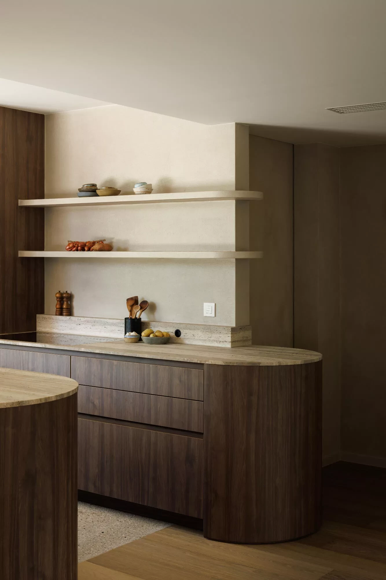 Thalostuc wall finish and walnut cabinetry