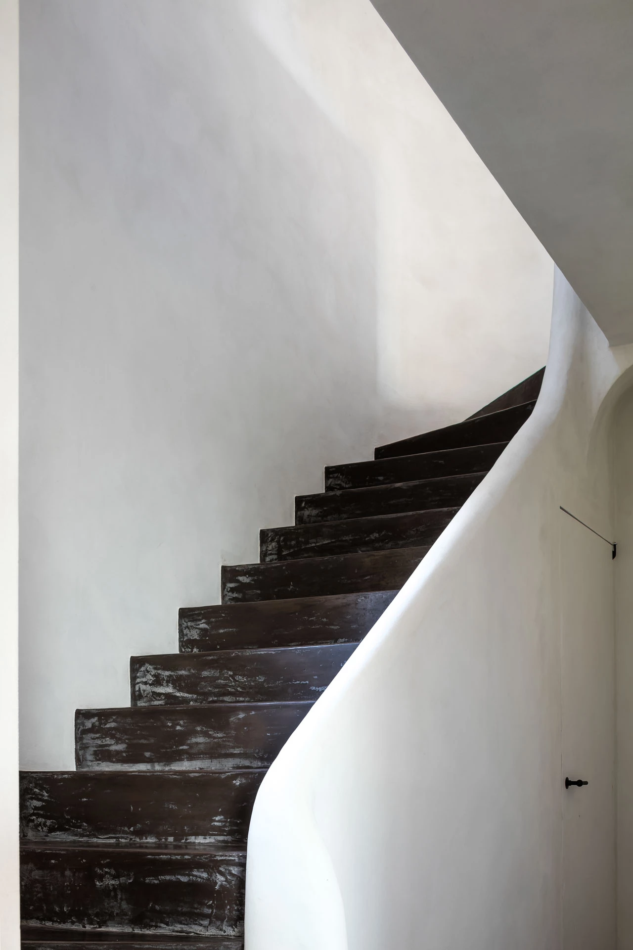 Contrast between black floor and white walls